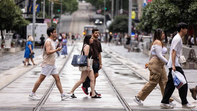 People carry shopping bags while walking along Bourke Street Mall in Melbourne. Picture: NCA NewsWire / Diego Fedele