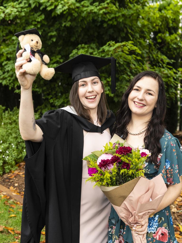 Bachelor of Business graduate Shenee McKenzie celebrates with Krystal Armstrong-Waters at the UniSQ graduation ceremony at Empire Theatres, Tuesday, December 13, 2022. Picture: Kevin Farmer