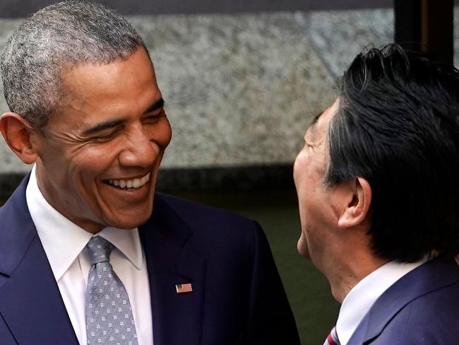 FBarack Obama shares a laugh with Japanese Prime Minister Shinzo Abe in Tokyo. Picture: AFP/Shizuo Kambayashi