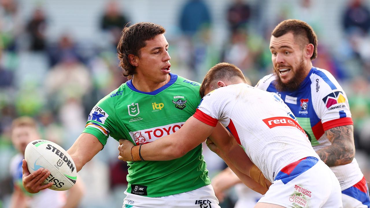 Joseph Tapine looks to offload against the Newcastle Knights. (Photo by Mark Nolan/Getty Images)