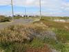 Dusty roads divide coastal community