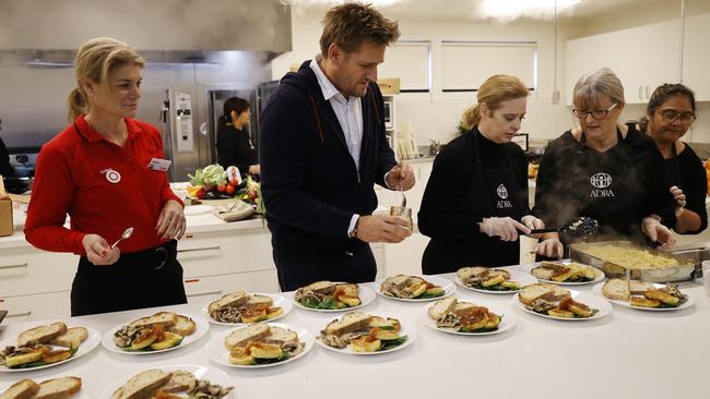 Curtis Stone with ADRA volunteers preparing breakfast on Wednesday for clients affected by homelessness and food insecurity. Picture: Alex Coppel