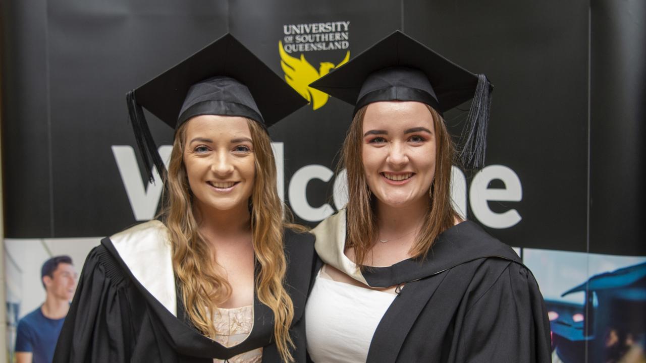 Sophie Kleinschmidt and Michaela Francis (both Bachelor of Creative Arts with distinction) at the USQ graduation ceremony on Wednesday, April 14, 2021. Picture: Nev Madsen.