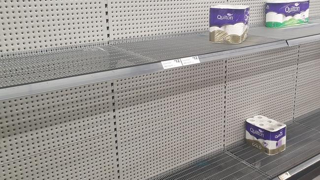 Toilet paper shelves at Woolworths in the Darwin CBD were almost bare by 3pm today. Picture: Shlok Sharma