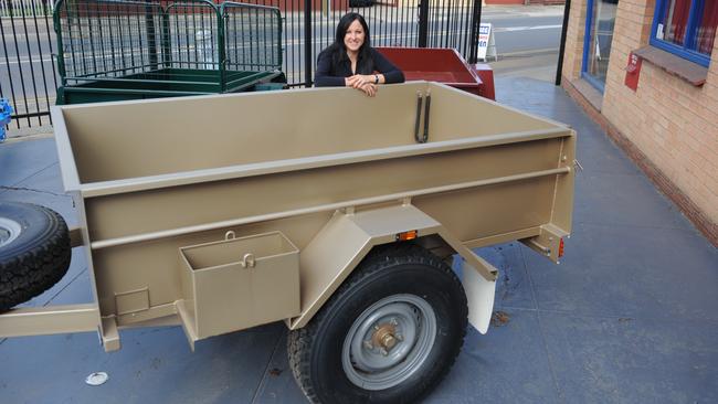 A Treg trailer pictured with an employee in 2011.