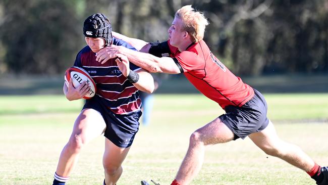 Angus Kelly tackling TSS’ Mason King.