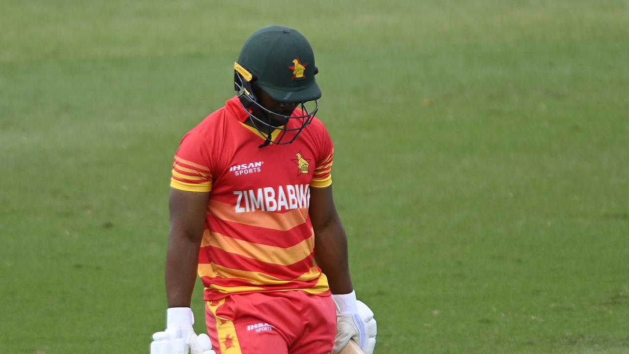 Regis Chakabva of Zimbabwe walks from the field after being dismissed.