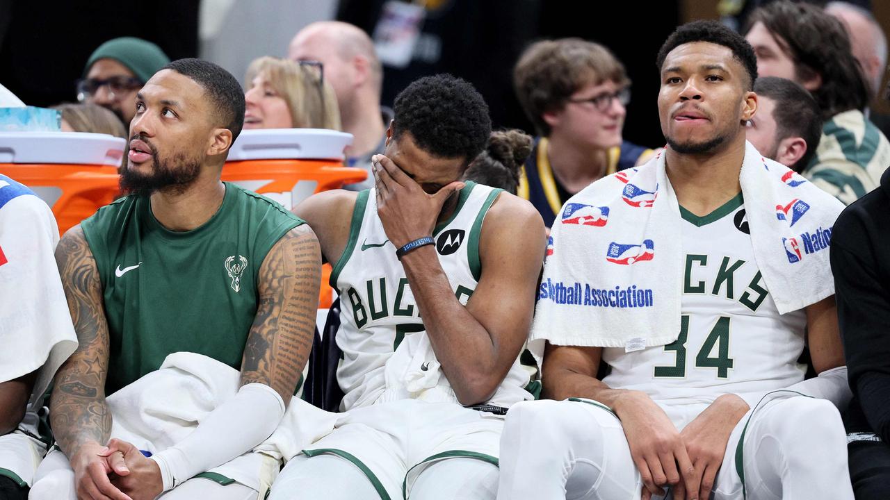 INDIANAPOLIS, INDIANA - JANUARY 03: Damian Lillard #0, Malik Beasley #5 and Giannis Antetokounmpo #34 of the Milwaukee Bucks sit on the bench in the final minute of the 142-130 loss to the Indiana Pacers at Gainbridge Fieldhouse on January 03, 2024 in Indianapolis, Indiana. NOTE TO USER: User expressly acknowledges and agrees that, by downloading and or using this photograph, User is consenting to the terms and conditions of the Getty Images License Agreement. Andy Lyons/Getty Images/AFP (Photo by ANDY LYONS / GETTY IMAGES NORTH AMERICA / Getty Images via AFP)