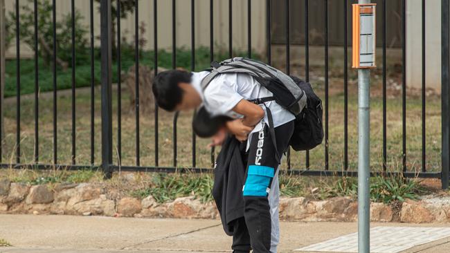 A child is bullied by an older child at a bus stop. Picture: Jason Edwards