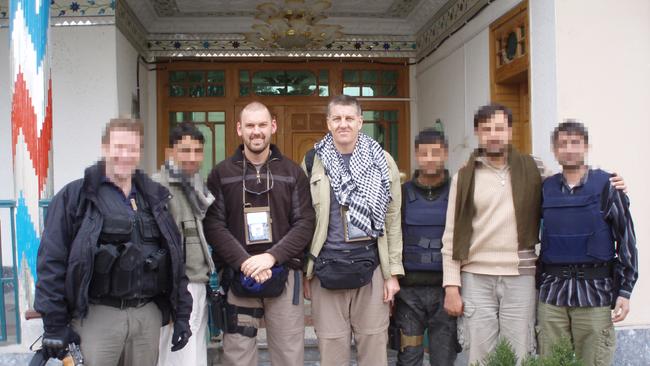 Former Australian Federal Police Detective Sergeant Kjell Brennemo, (third from left) with partner Michael Duthie (centre) with their team in Afghanistan. Picture: supplied