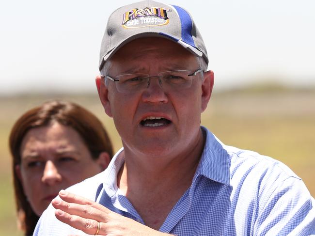 15/2/2019: PM Scott Morrison holds a press conference on the main road after he inspected the twisted and destroyed main railway line running between Mount Isa and Townsville with local mayors, which is surrounded by the rotting carcasses of dead cattle  after floods sweep through the area earlier this week,  just east of Julia Creek about 3 hrs east of Mount Isa. The railway line may be unusable for some time, with a huge amount of repair work to be done . Lyndon Mechielsen/The Australian