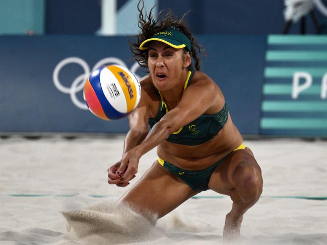 Taliqua Clancy digs the ball in the women's bronze medal beach volleyball match. Picture: AFP