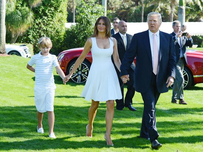 The Trumps, with son Barron, attend an event at Mar-a-Lago in 2013. Picture: Getty Images