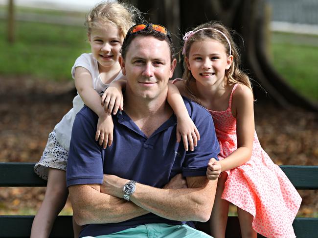 Will Anderson, with his daughters Olivia, four, and Charlotte, seven, is the only dad at daytime school activities. Picture: Annette Dew