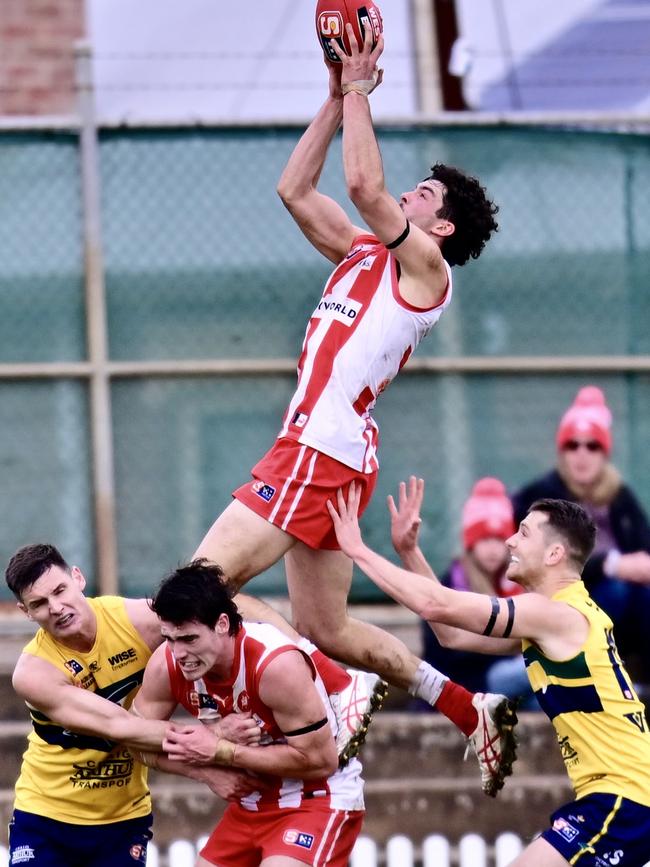 North Adelaide's Karl Finlay flies high to take a spectacular mark of the year contender against the Eagles at Woodville Oval. Picture: Scott Starkey/SANFL