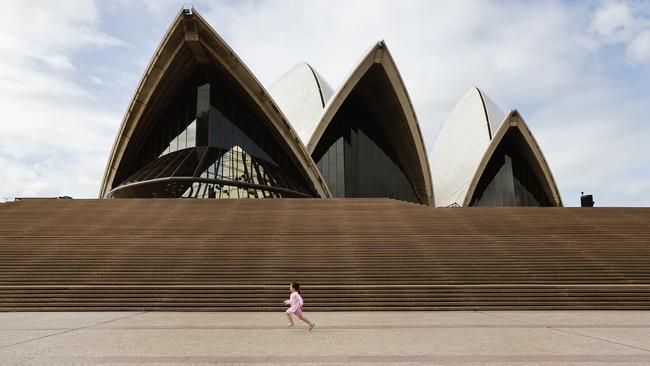 One little girl took advantage of having the unusually quiet Opera House forecourt to herself. Picture: Richard Dobson