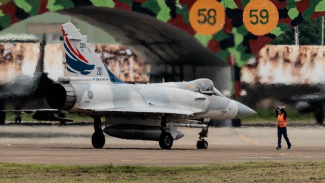 A Taiwanese air force Mirage 2000 fighter jet prepares for take off at a base in Hsinchu in northern Taiwan after China announced it had encircled the island. Picture: AFP