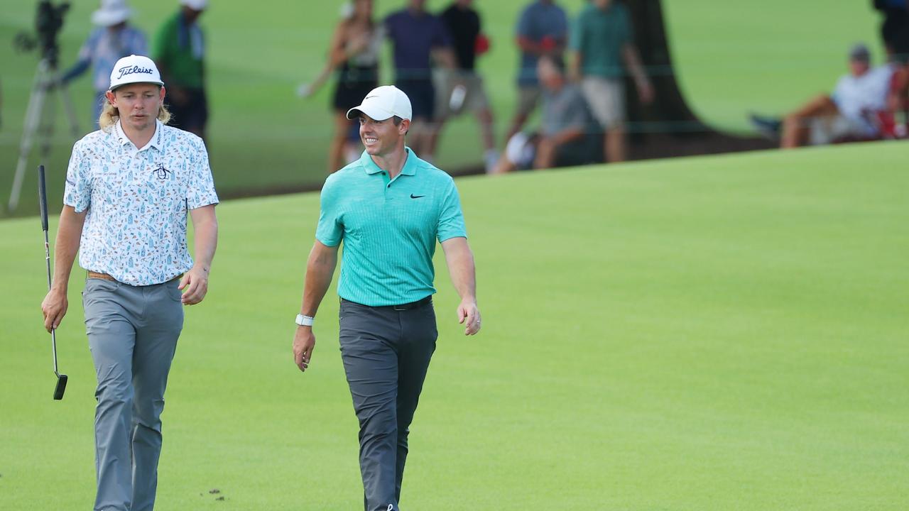 Cameron Smith and Rory McIlroy walk on the 18th hole.  (Photo by Kevin C. Cox/Getty Images)
