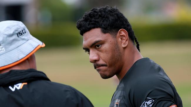 Wests Tigers train ahead of their round 1 game against Manly. Thomas Mikaele talks to coach Michael Maguire. Picture: Toby Zerna