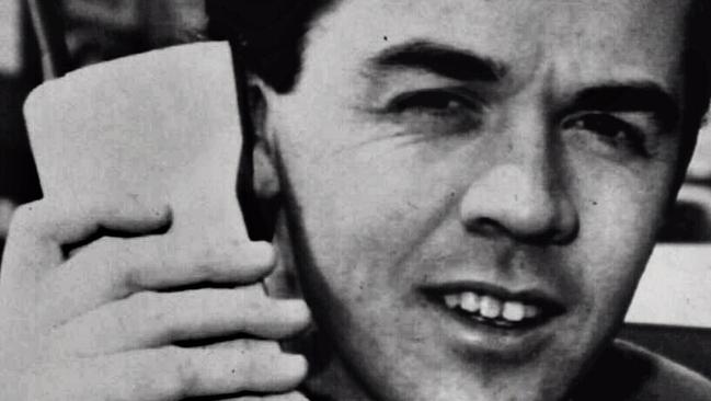 Generic Man using one of the very early mobile phones - Communications / old style headshot phone