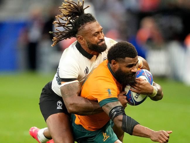 Australia's left wing Marika Koroibete (R) is tackled by Fiji's captain Waisea Nayacalevu (L) Picture: Francis BOMPARD / AFP