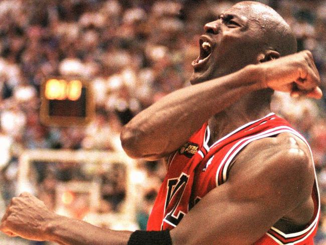 Michael Jordan celebrates his game-winning shot to seal the title in 1998.