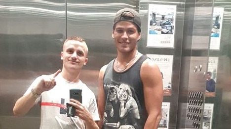 Mat Gilchrist with best friend Dylan Elliott, who remains in an induced coma after allegedly being bludgeoned over the head with a hammer. Picture: Facebook