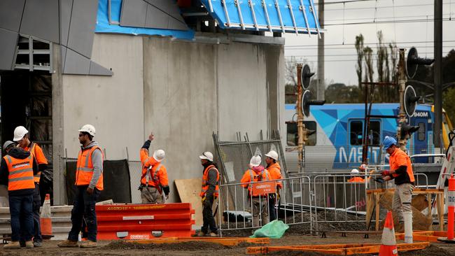 Workers remove a level crossing from Bayswater Road at Bayswater Station. Picture: The Australian.