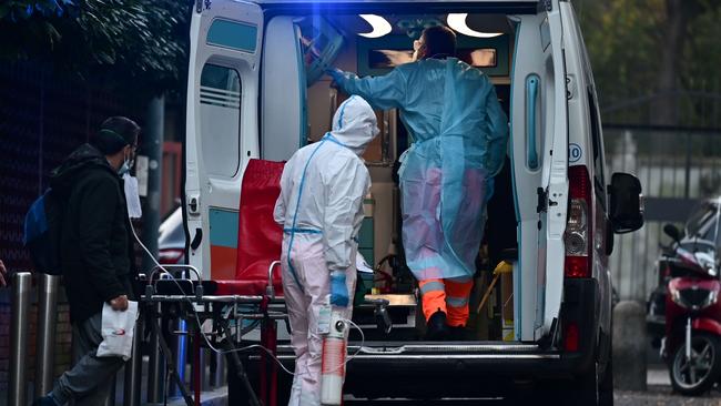 Medics attend an emergency callout in Milan last week. Picture: AFP