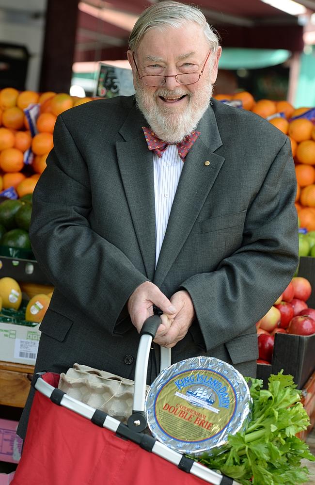 Eats fish or meat every night with vegetables ... Obesity Australia head, Professor John Funder, with double brie cheese in his basket at Victoria Markets in Melbourne. Photo: Kris Reichl