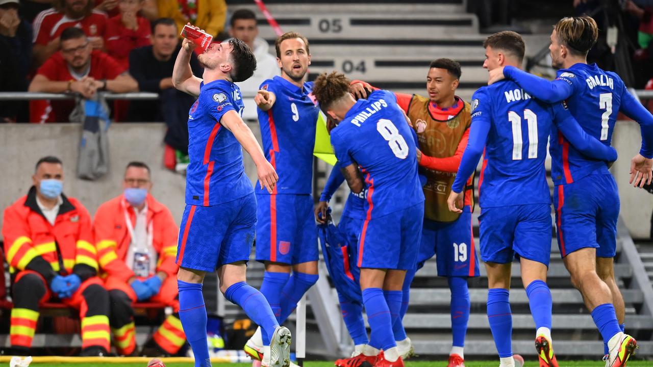 Declan Rice of England drinks from a cup that was thrown at Raheem Sterling after opening the scoring against Hungary.