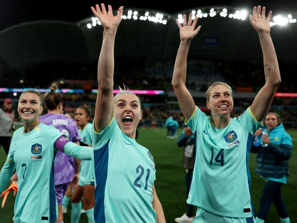 Aussie heroes: Steph Catley, Ellie Carpenter and Alanna Kennedy acknowledge fans after the team's 4-0 victory versus Canada in Melbourne. Picture: Alex Pantling/Getty Images