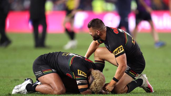 Mansour consoling Viliame Kikau after their devastating Grand Final loss to Melbourne. Picture: Getty Images.