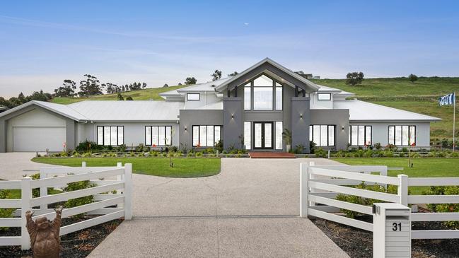 Selling $2.5m-$2.7m: The six-bedroom residence at 31 Millpond Lane, Batesford, almost has it all, from a 26m fish pond water feature, Bose integrated Sonos outdoor sound system, six truffle-inoculated oak trees, wifi controlled gates and an oversized garage with a golf simulator.