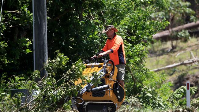 Locals took to ride-on movers to help clear away the strewn wreckage themselves. Picture: NCA NewsWire / Scott Powick