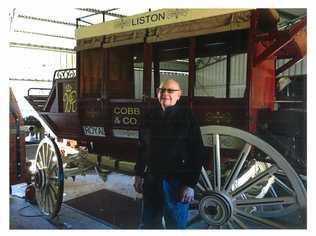 HERITAGE DONATION: John Burton with the Cobb & Co coach he built from scratch. Picture: Contributed