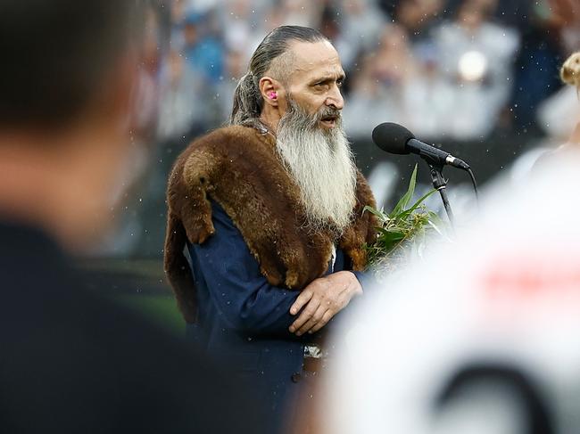 MELBOURNE, AUSTRALIA - APRIL 25: Uncle Colin Hunter delivers Welcome to Country during the 2025 AFL Round 07 match between the Collingwood Magpies and the Essendon Bombers at the Melbourne Cricket Ground on April 25, 2025 in Melbourne, Australia. (Photo by Michael Willson/AFL Photos via Getty Images)