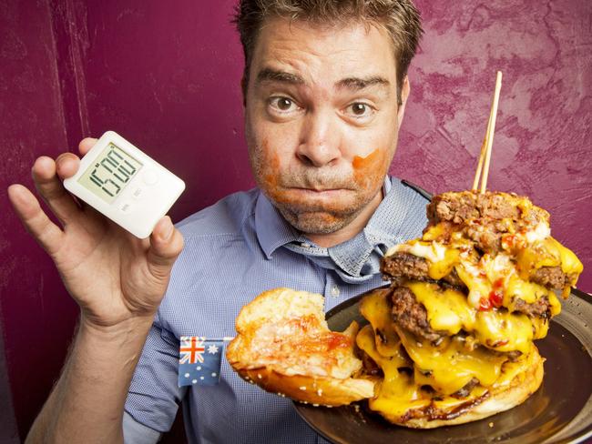 Herald Sun journalist Andrew Jefferson came up short on the JD's burger challenge. Picture: Nathan Dyer