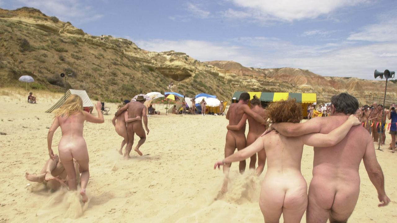 Couples during three-legged race on Maslin Beach in Adelaide at 18th Nude Olympics. Picture: James Knowler