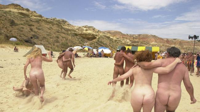 Couples during three-legged race on Maslin Beach in Adelaide at 18th Nude Olympics. Picture: James Knowler