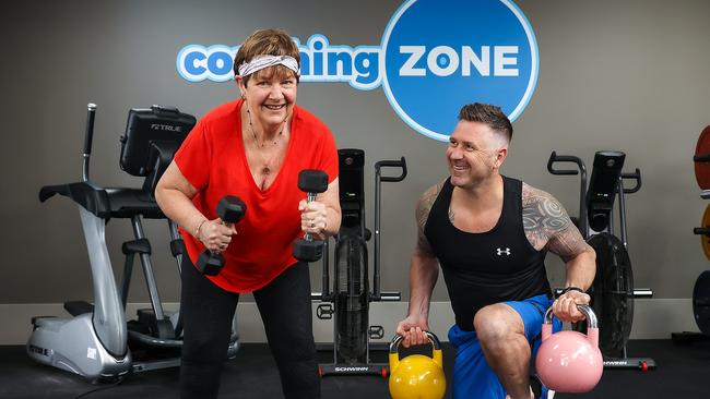 Pam Campbell and Brendan Purcell get ready for the opening of gyms in Melbourne. Picture: Ian Currie