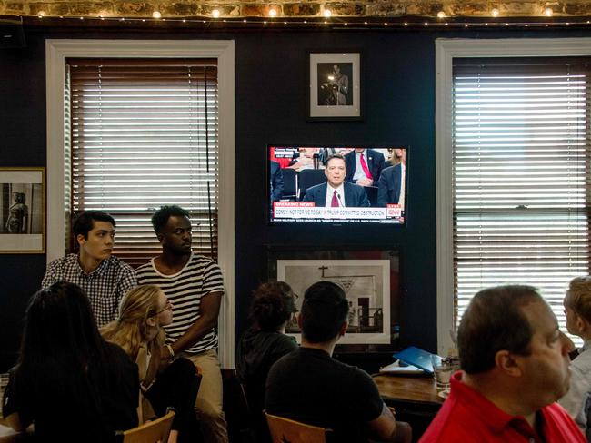 Patrons at Shaw's Tavern watch James Comey’s testimony. Picture: AFP/Jim Watson