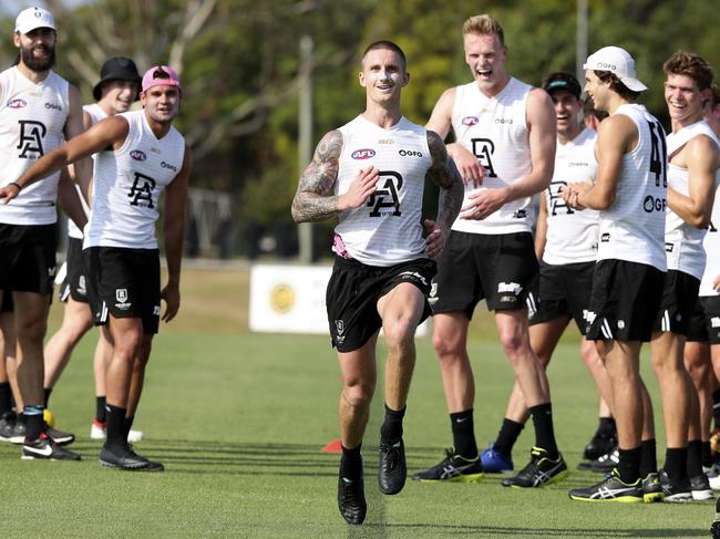 AFL - Port Adelaide training camp,  Maroochydore Queensland - DAY 3 Oval training. Hamish Hartlett doing a top up speed test (due to coming back from injury)  - with the support of his team mates Picture SARAH REED