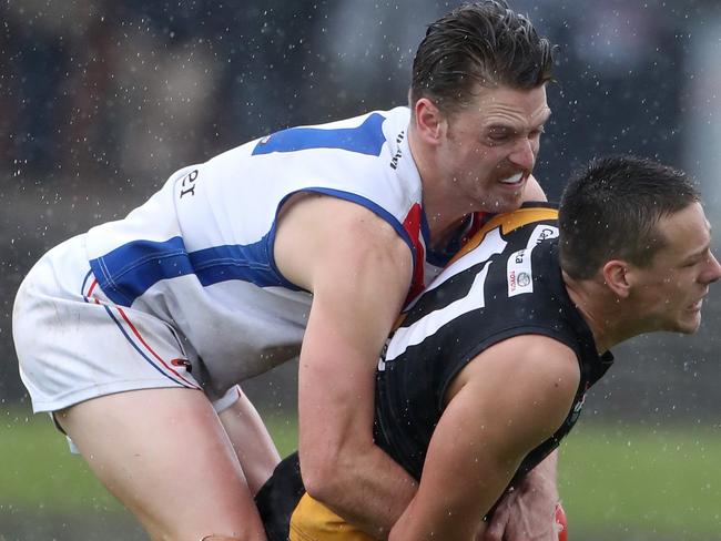 Jackson Clarke of WPL tackles Christian Buykx-Smith of Heid during the NFL Football Div 1 match between West Preston-Lakeside and Heidelberg played at Preston City Oval on Sunday 8th September, 2019.