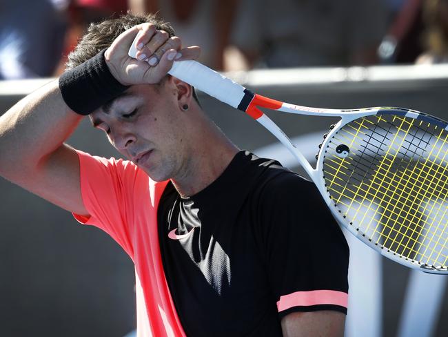 The pressure shows on Thanasi Kokkinakis, who wipes away sweat from his forehead. Picture: David Caird