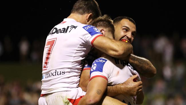 WOLLONGONG, AUSTRALIA - MARCH 26: Zac Lomax of the Dragons celebrates with Ben Hunt and Josh Kerr of the Dragons after scoring a try during the round three NRL match between the St George Illawarra Dragons and the Manly Warringah Sea Eagles at WIN Stadium on March 26, 2021, in Wollongong, Australia. (Photo by Mark Kolbe/Getty Images)