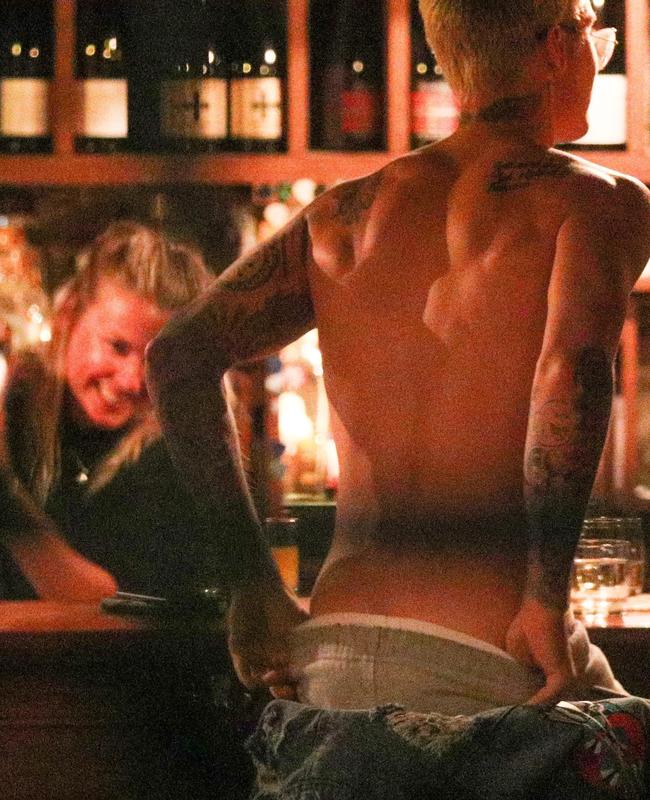 The bartender looks mesmerised. Picture: AKM-GSI/BackGrid