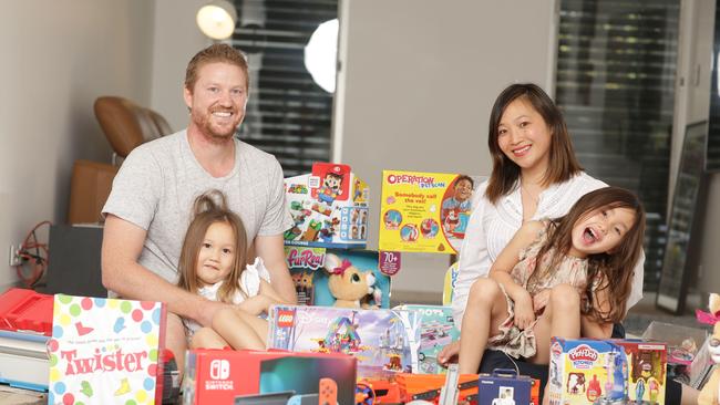 Mitch and Priscilla Sidey with their daughters Evelina (3) and Sienna Sidey (5). Picture: Christian Gilles