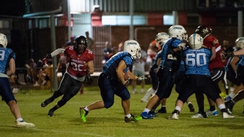 Malakai Railton-Stewart (wearing red) in action.