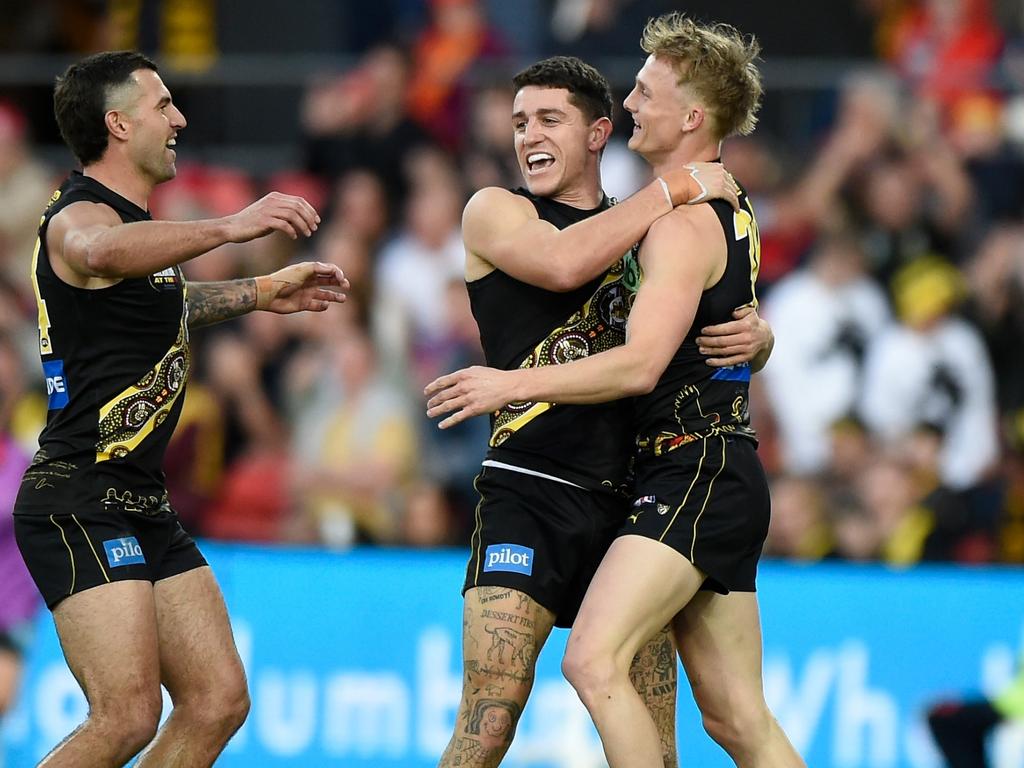 Mabior Chol (left) of the Tigers grapples with Caleb Graham (right) of the  Suns during the Round 12 AFL match between the Richmond Tigers and Gold  Coast Suns at the Gabba in